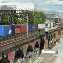 Freight train and passenger train at Manchester Oxford Road