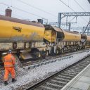 Network Rail engineering train and workers in orange suits