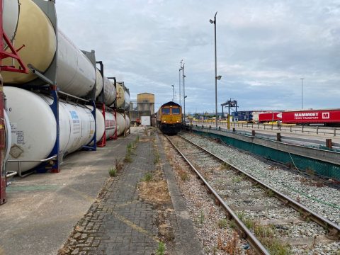 Looking down an Industrial siding towards a GBRf train at Aggregate Industries Purfleet in Essex