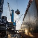 Image shot from the quayside as bulk load is transferred from a ship at Port of Tyne