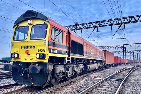 Ground level shot of Freightliner 66503 with container train