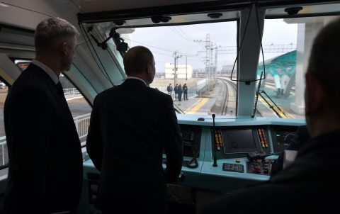 Russian President Vladimir Putin travels aboard a rail-bus from Kerch to Taman before the opening ceremony of the railway part of the Krymsky, source: ANP