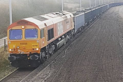 Biffa liveried class 66 operated by GB Railfreight hauls another waste train