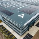 Roof of a modern logistics park warehouse with the Tritax logo prominent