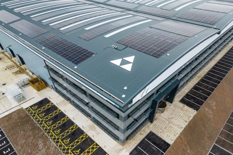 Roof of a modern logistics park warehouse with the Tritax logo prominent