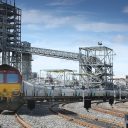 Freight train leaving Drax Power Station with empty biomass trucks