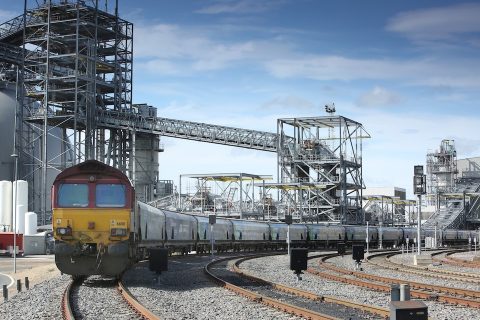 Freight train leaving Drax Power Station with empty biomass trucks