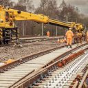 Network Rail engineers on tracks with a rail mounted crane