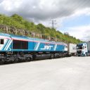 Newell and Wright locomotive and train at Tinsley in Sheffield with road truck in background