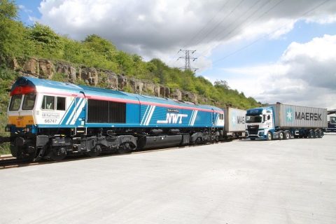 Newell and Wright locomotive and train at Tinsley in Sheffield with road truck in background