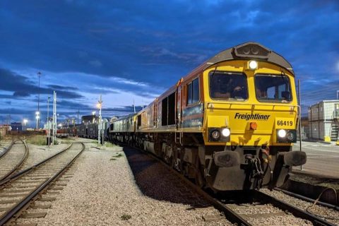 seen from infant of the first locomotive a double headed Freightliner Intermodal service under a very blue sky