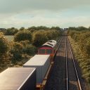 Video still of an intermodal train viewed from an over bridge as the locomotive and leading wagons travel away into the distance in a rural setting