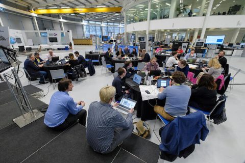 Academic meeting with delegates and laptops