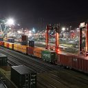 Night shot of intermodal train departing docks